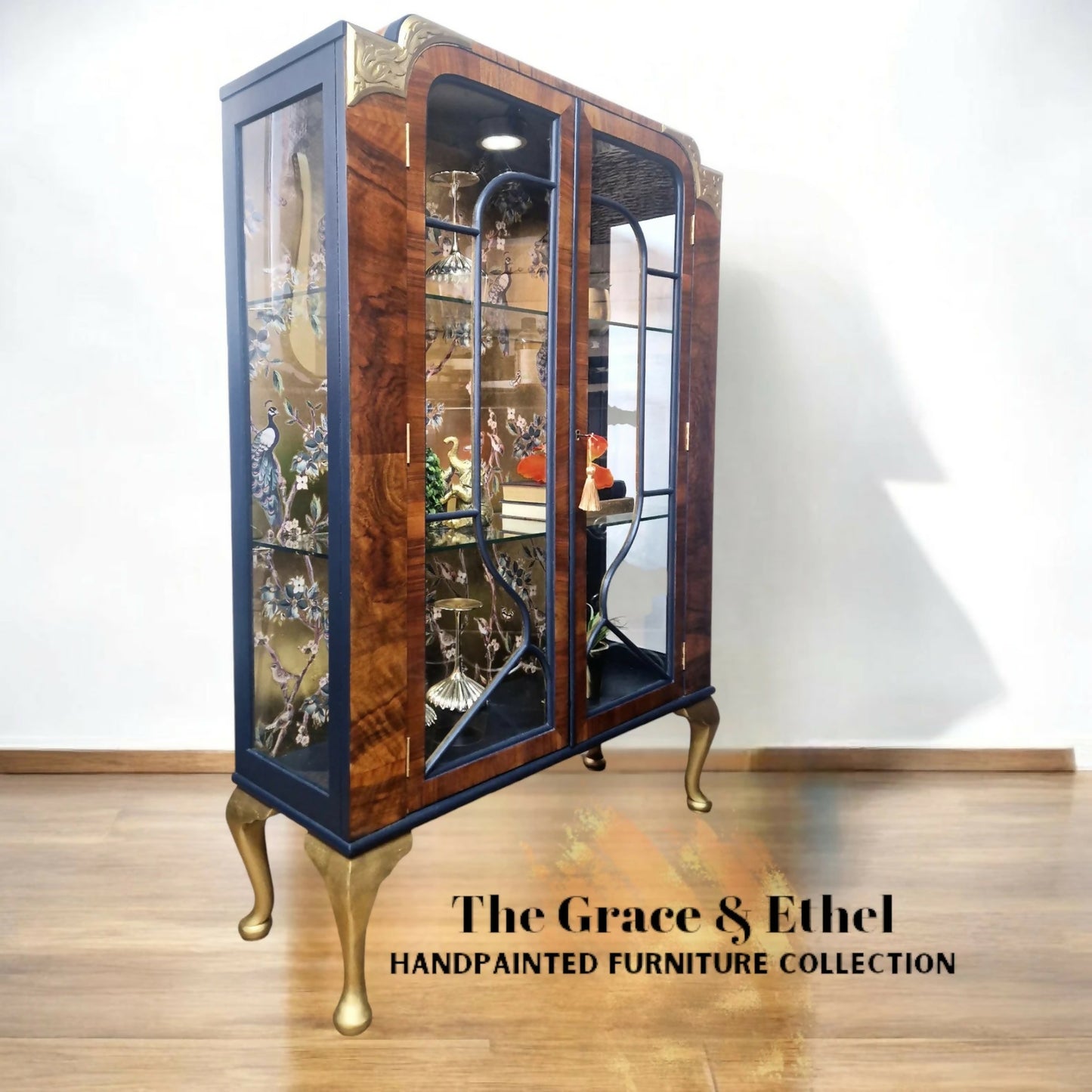 art deco peacock navy and gold glass cabinet