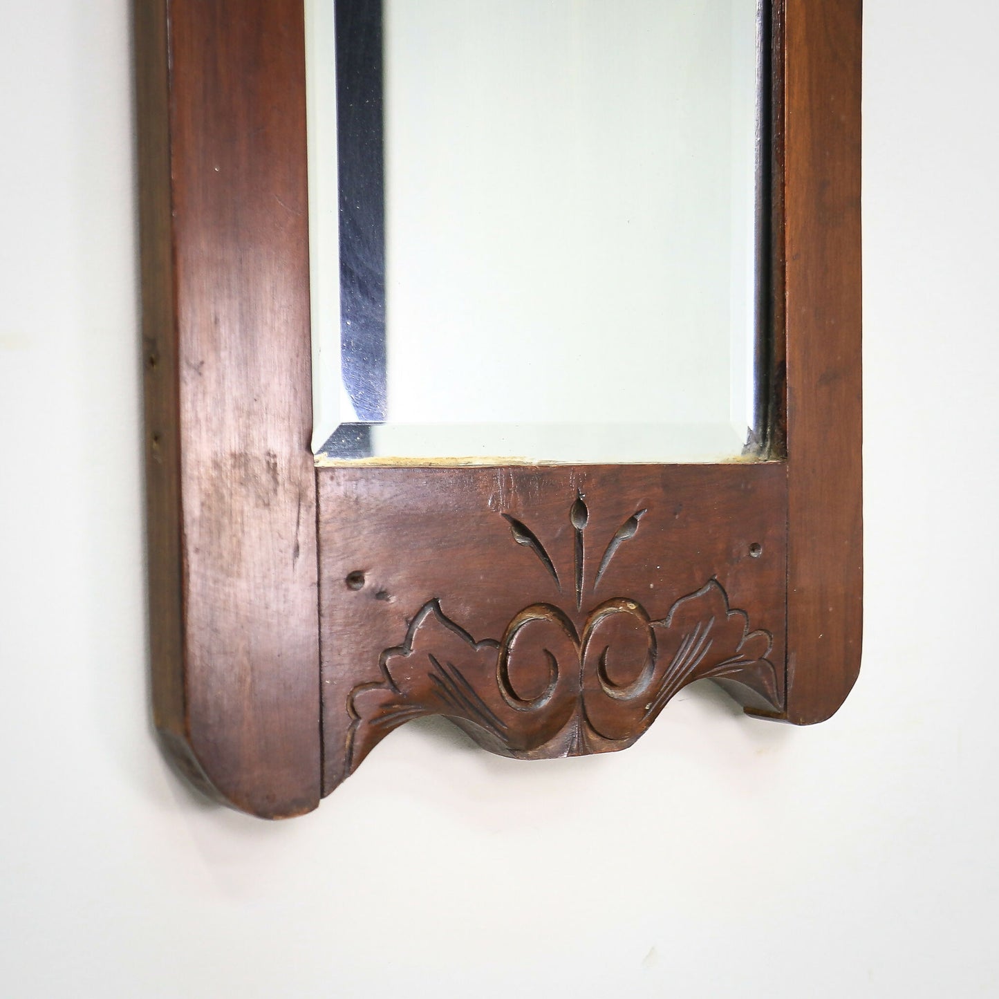 A Pair of Victorian Wall Mirrors Bevel Edged Glass Carved Top and Bottom