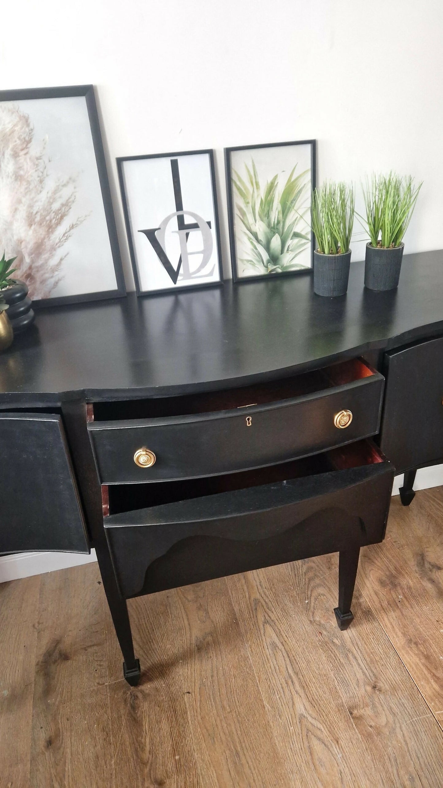 Black vintage serpentine sideboard