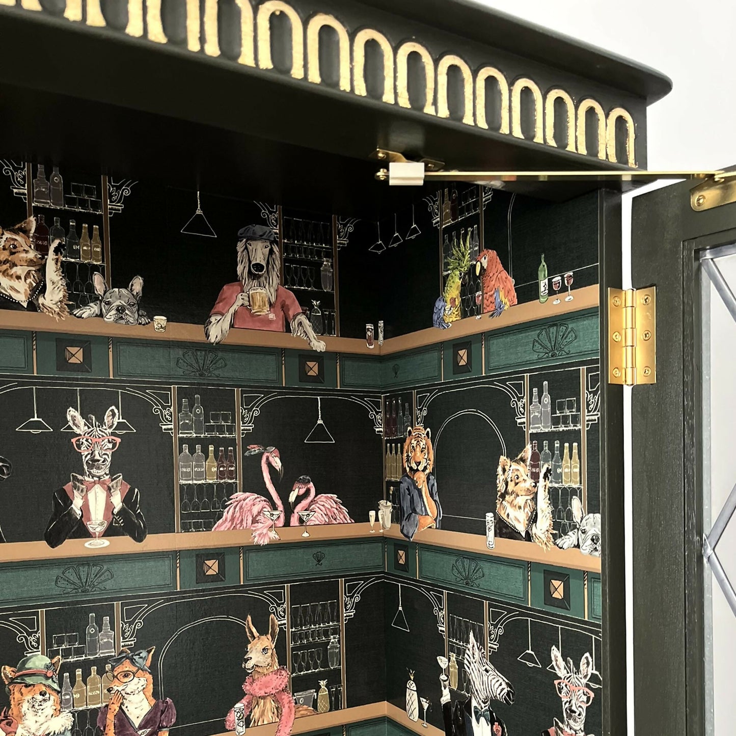Antique style display cabinet with animals in the bar, painted green and gold guilded - Copy
