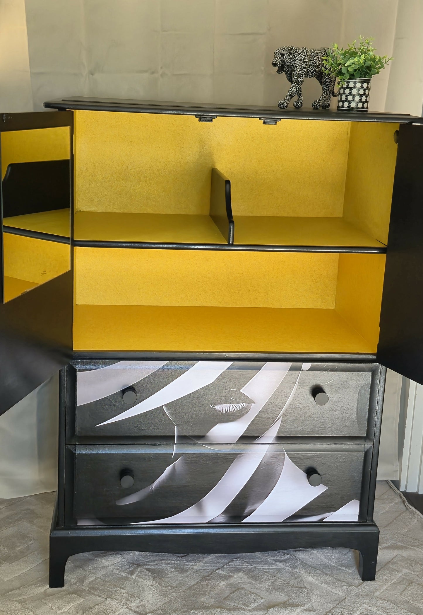 Stag Linen Press | Jet Black Gloss Cabinet with Striking Femme Artwork & Dramatic Yellow Interior