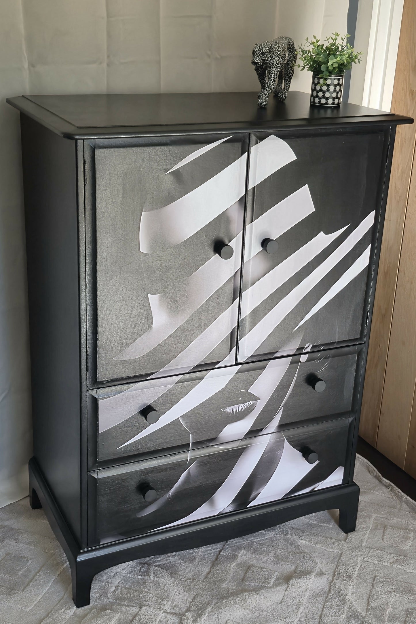 Stag Linen Press | Jet Black Gloss Cabinet with Striking Femme Artwork & Dramatic Yellow Interior