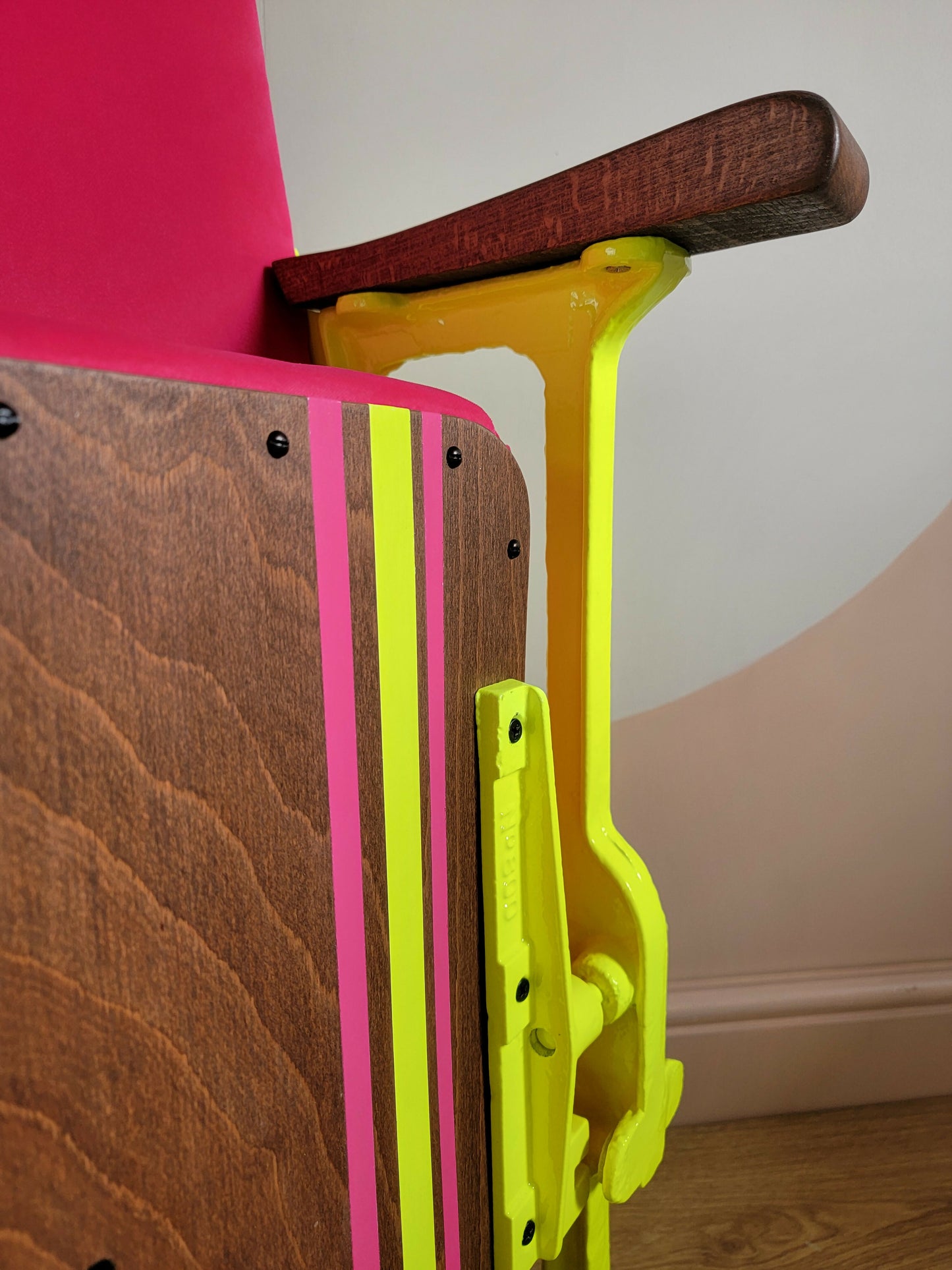 Neon pink cinema seat-angle close up-seat up-Orange Otter