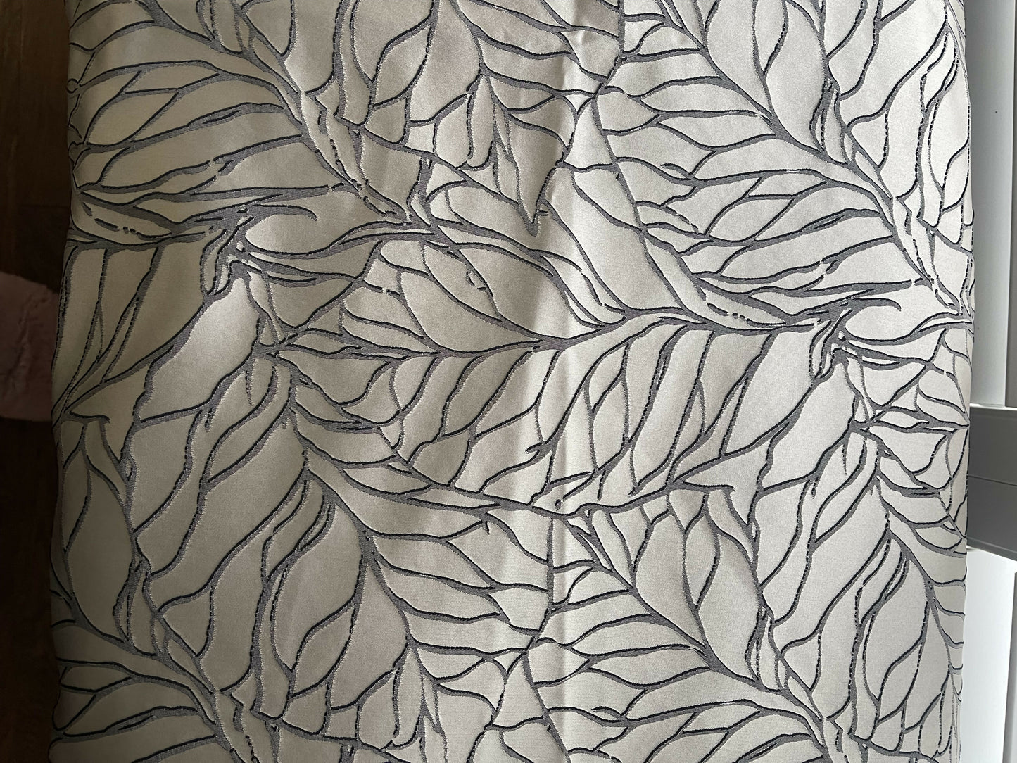 Black satin painted Lloyd loom ottoman. You choose the fabric