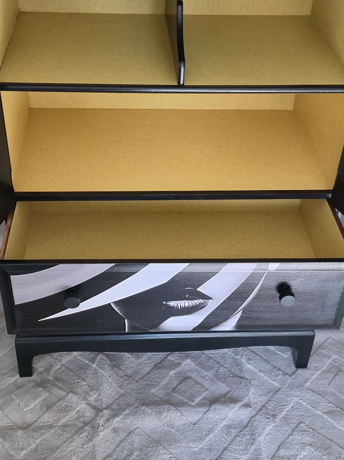 Stag Linen Press | Jet Black Gloss Cabinet with Striking Femme Artwork & Dramatic Yellow Interior