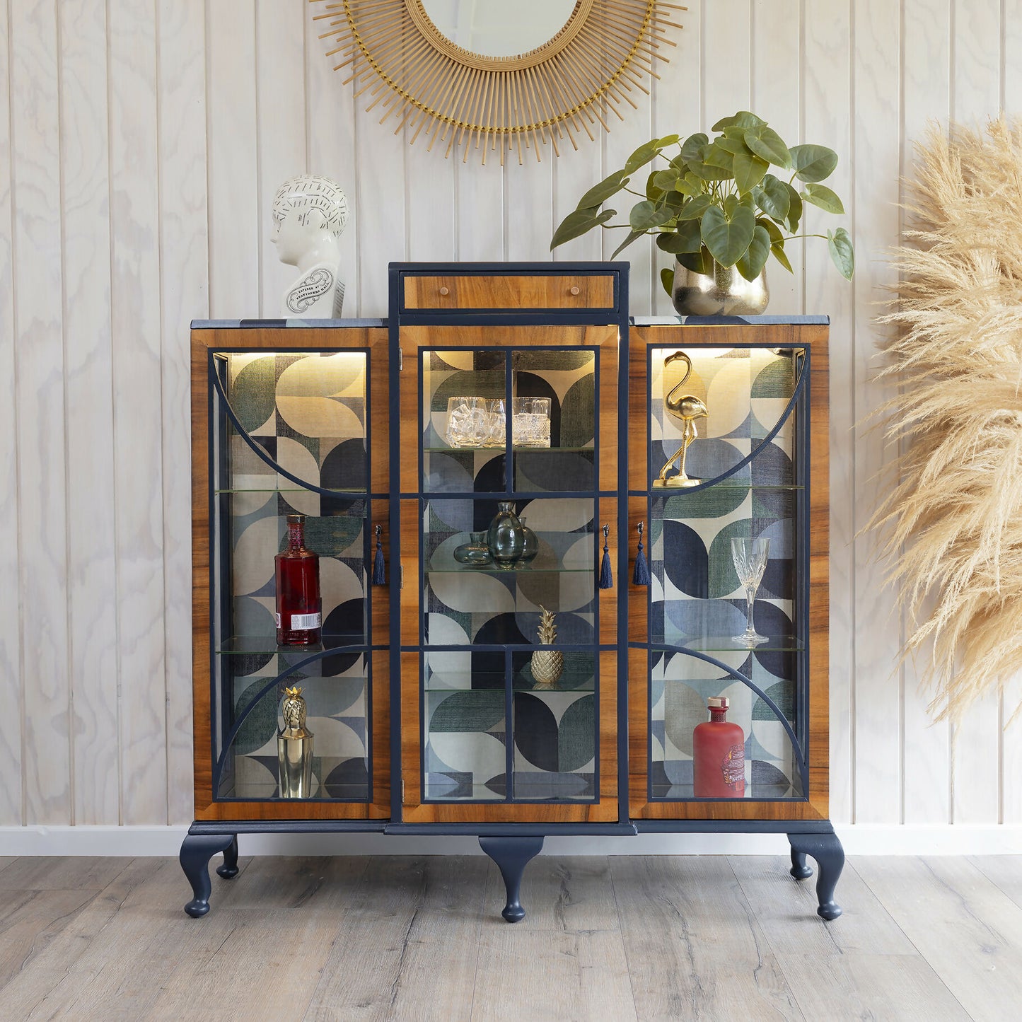 A unique Art Deco drinks cabinet, decoupaged in a striking blue Bauhaus fabric. Sold: Commission available.