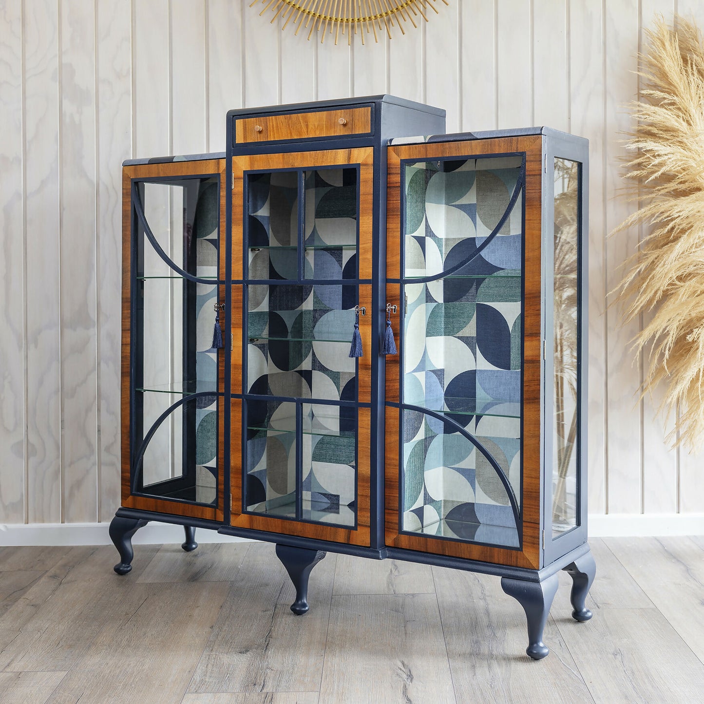 A unique Art Deco drinks cabinet, decoupaged in a striking blue Bauhaus fabric. Sold: Commission available.