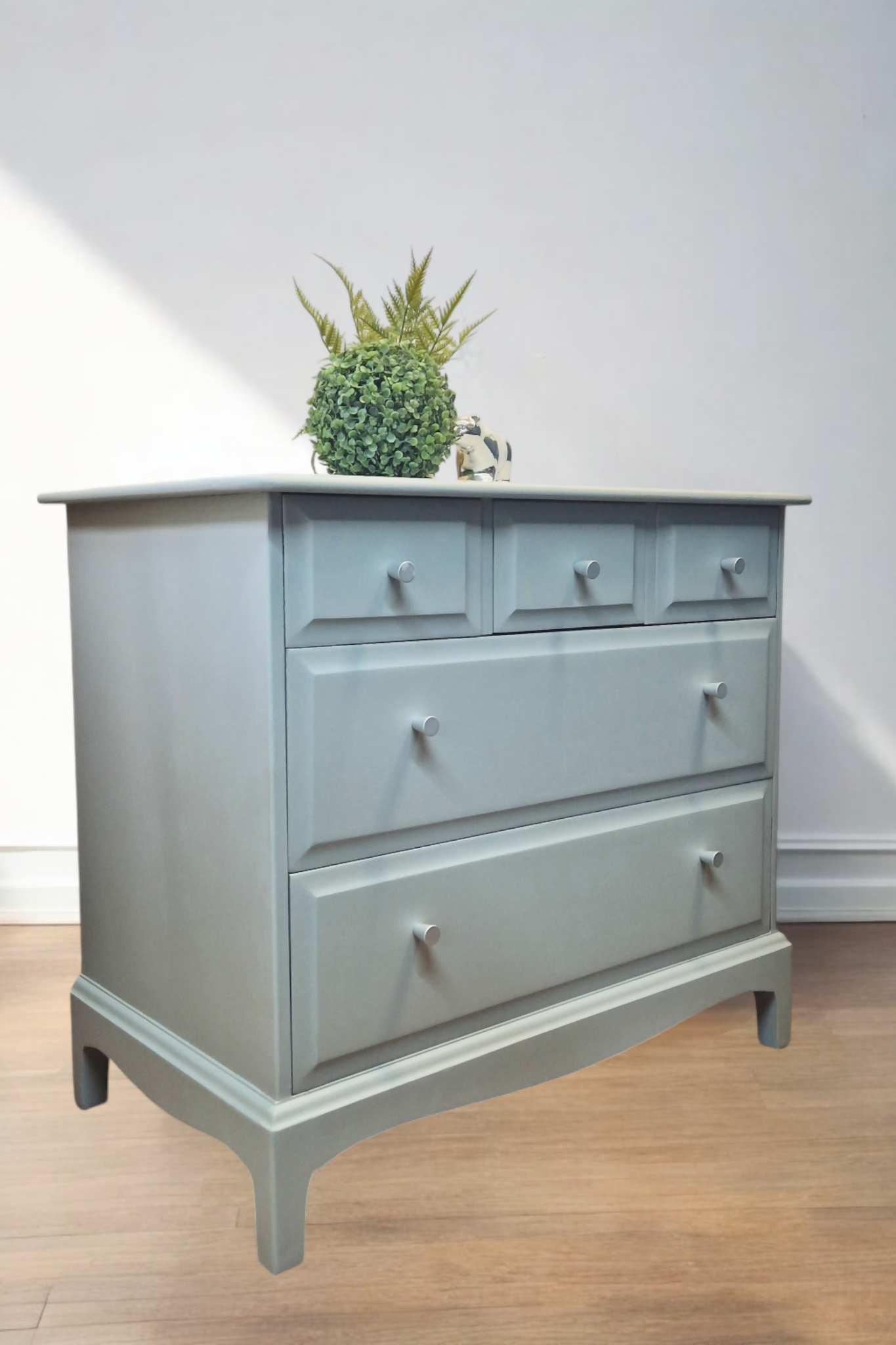 Stag Minstrel Chest of Drawers on Grey, Oversize bedside table