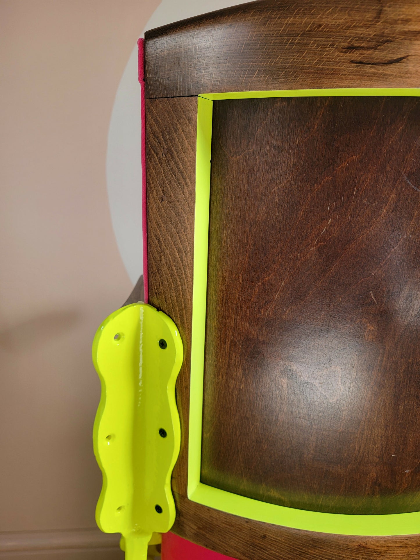 Neon pink cinema seat-back close up-Orange Otter