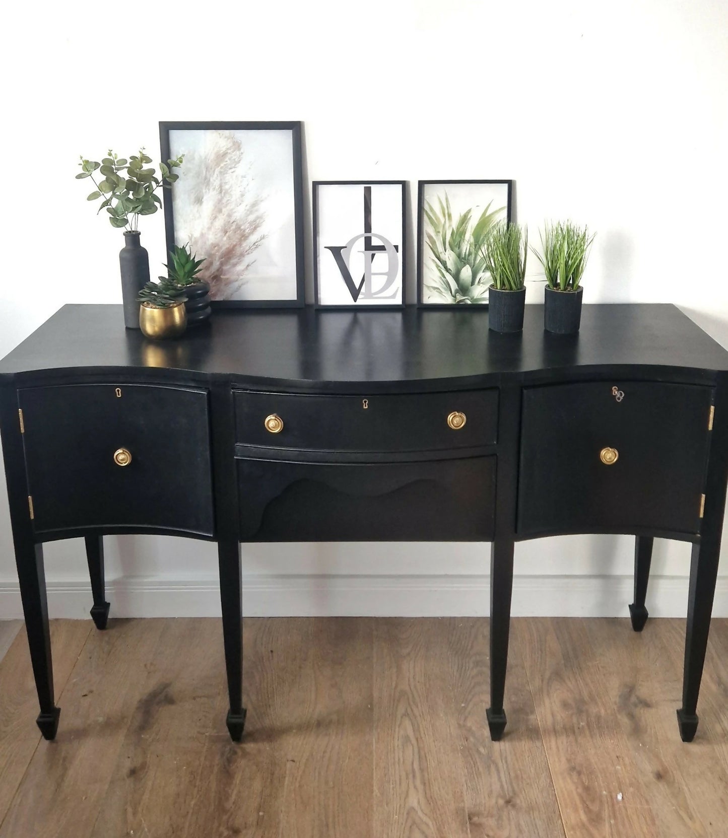 Black vintage serpentine sideboard