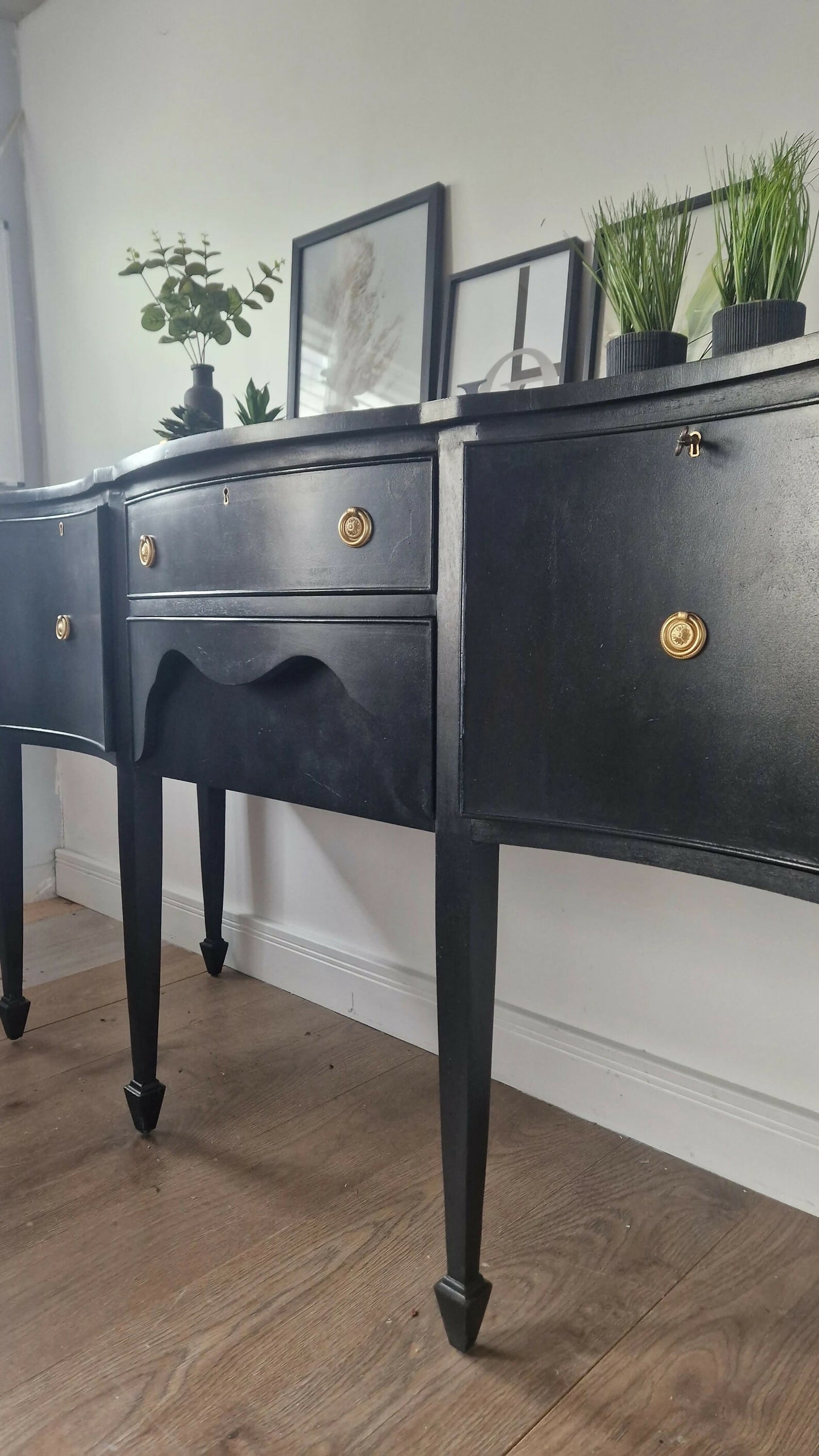 Black vintage serpentine sideboard