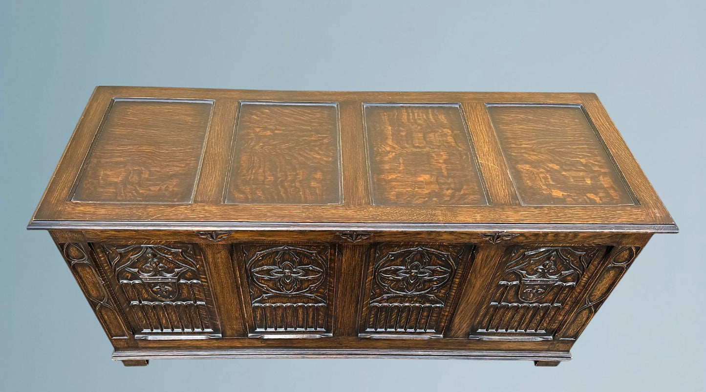 A Large Carved Oak Bedding or Blanket Box With Raised Linen Fold Panels