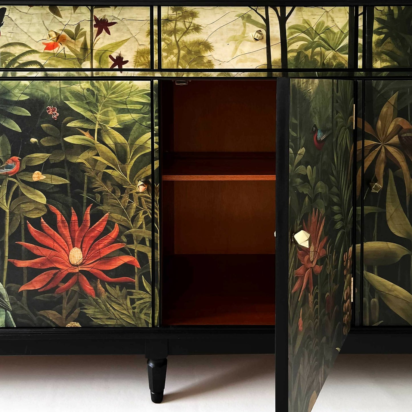 sideboard decorated with jungle design from close door open