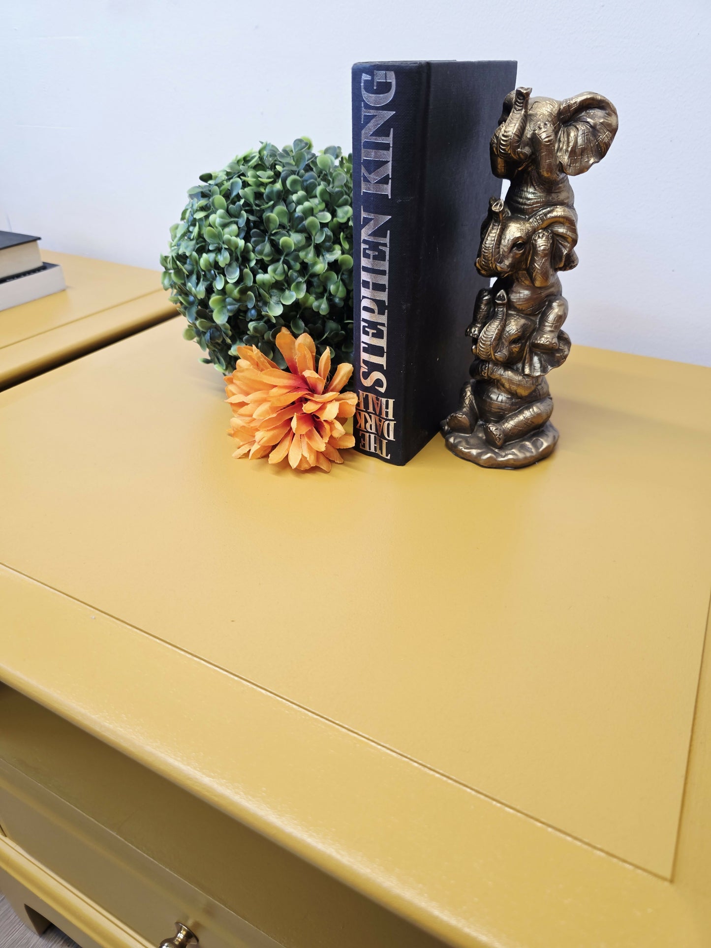 mustard yellow stag minstrel bedside cabinets