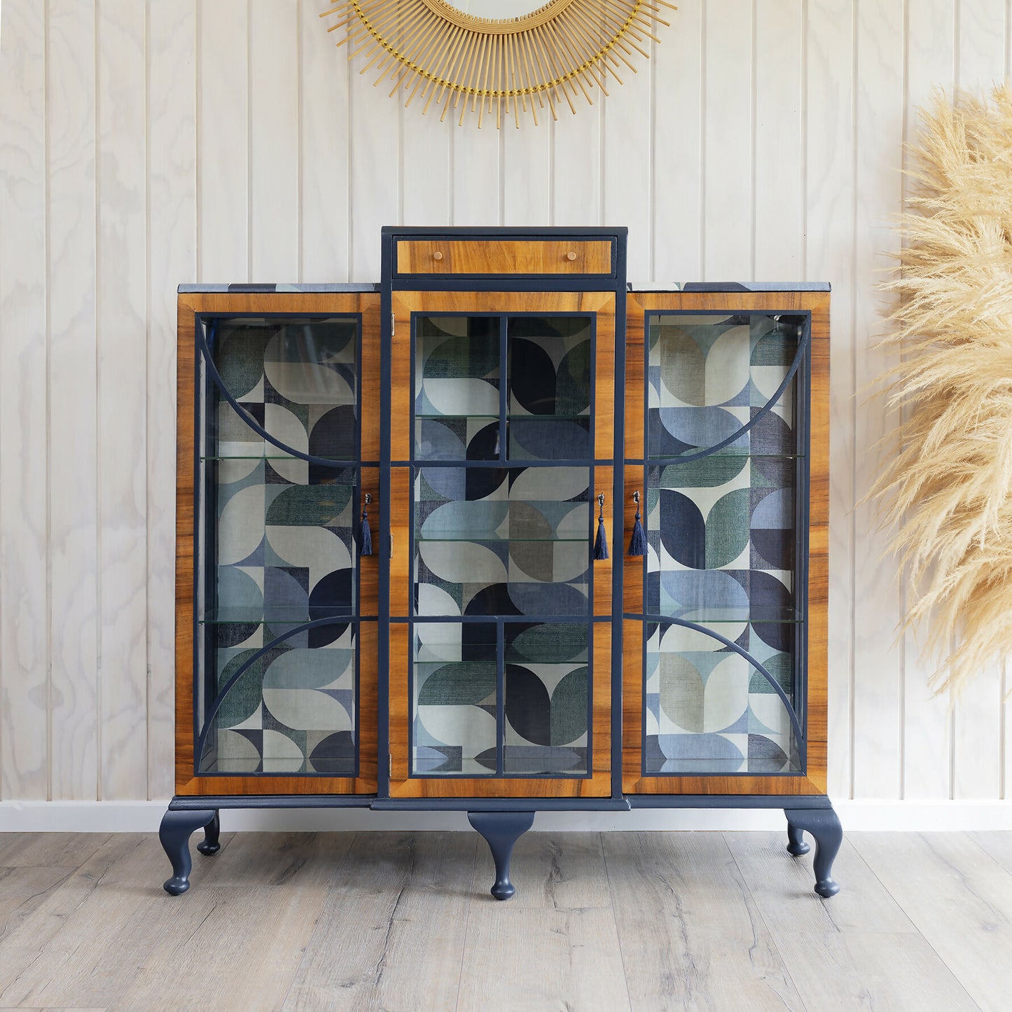 A unique Art Deco drinks cabinet, decoupaged in a striking blue Bauhaus fabric. Sold: Commission available.
