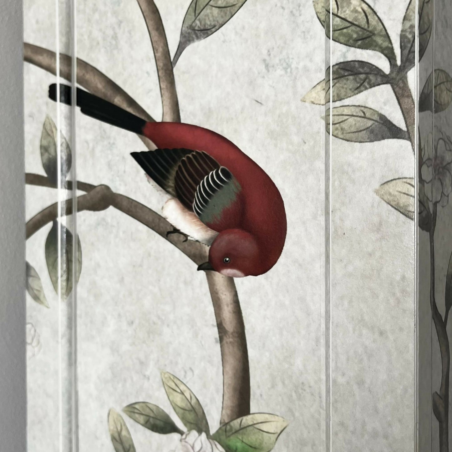 Red bird on the wall of vintage chinese cabinet