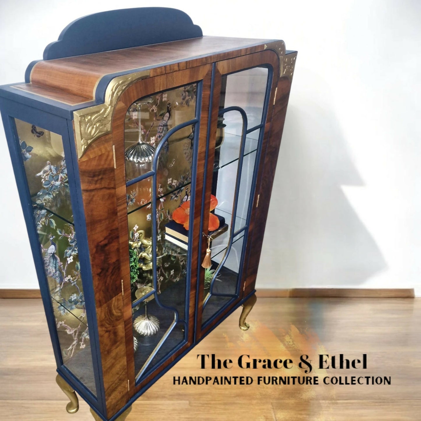 art deco peacock navy and gold glass cabinet