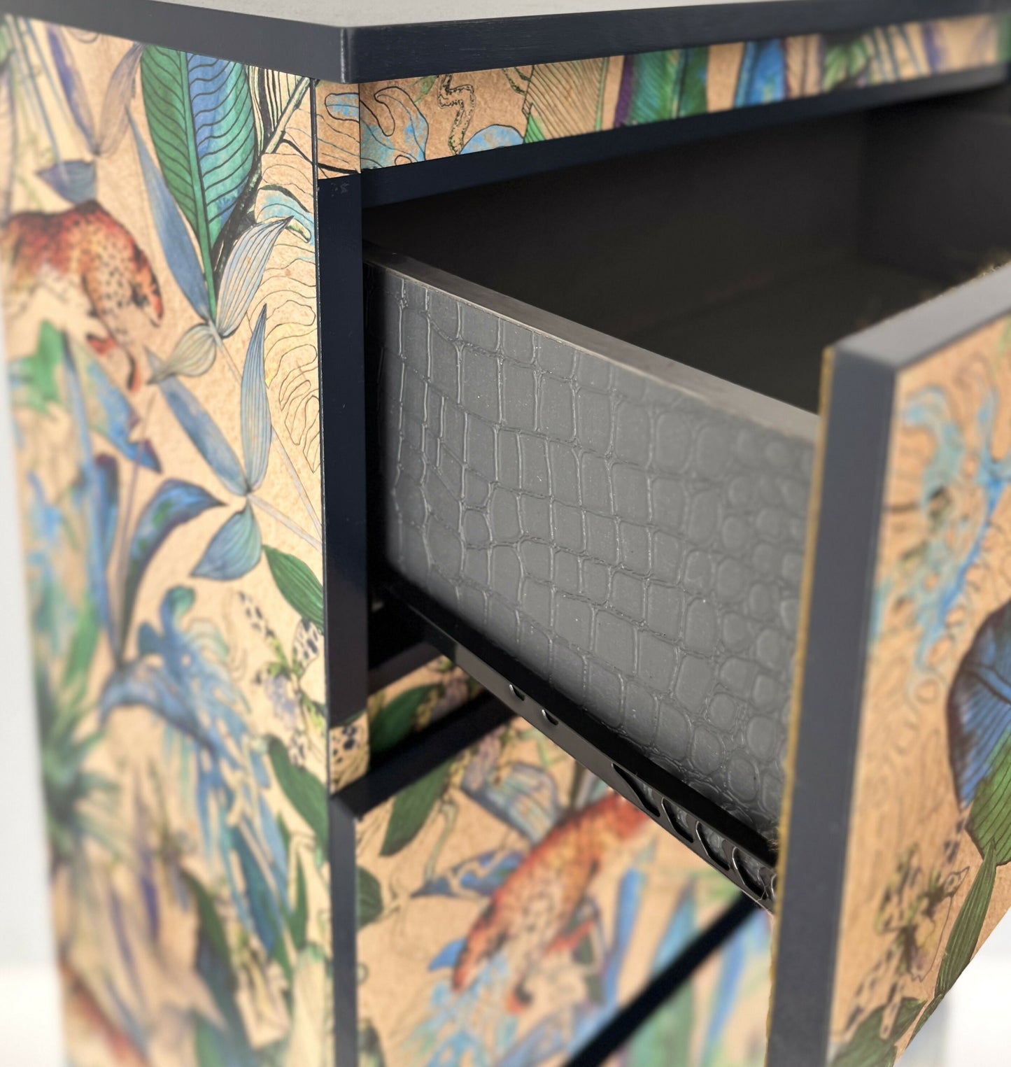 side of the drawers decorated with crocodile skin texture