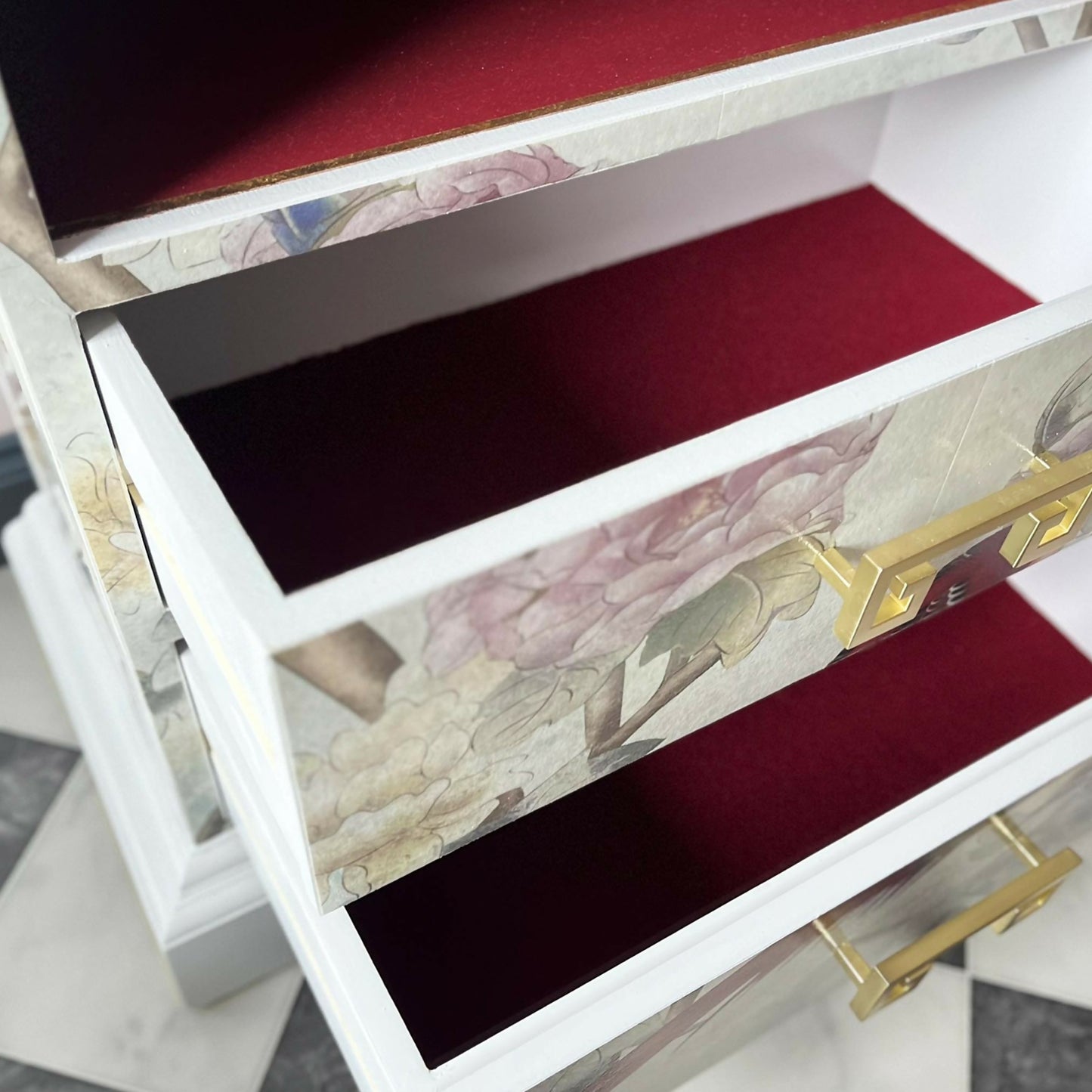 Red fabric layed drawers of bespoke chinoiserie cabinet