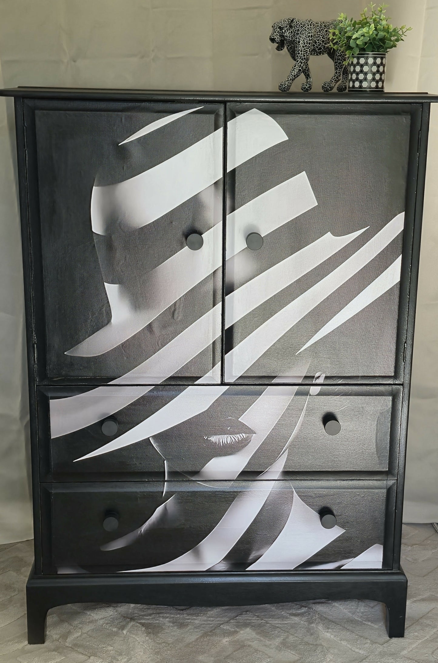 Stag Linen Press | Jet Black Gloss Cabinet with Striking Femme Artwork & Dramatic Yellow Interior