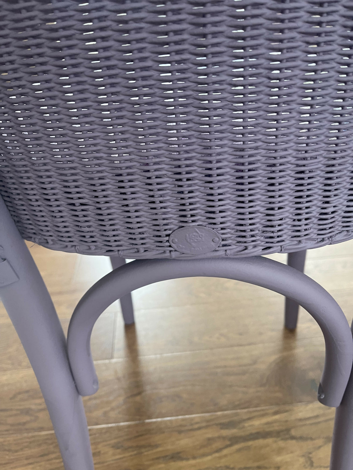 Stylish Lloyd loom accent chair very Matt aubergine paint and matching cotton lily themed fabric