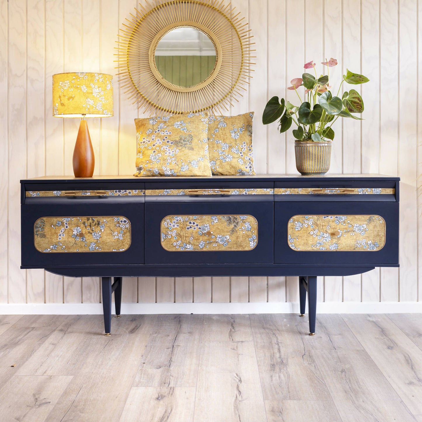 Blue mid century sideboard with an integrated cocktail bar, featuring a captivating blend of midnight blue and oriental fabric. Sold, commission available.