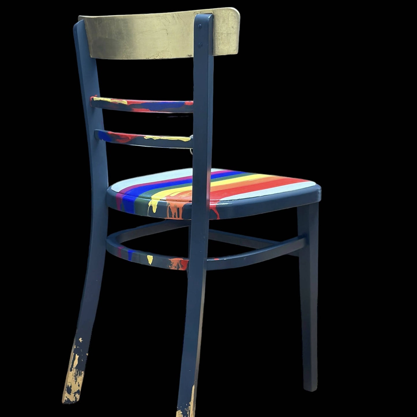 Hand painted school chair with vibrant rainbow stripe seat and gold leaf backrest. Abstract art design.