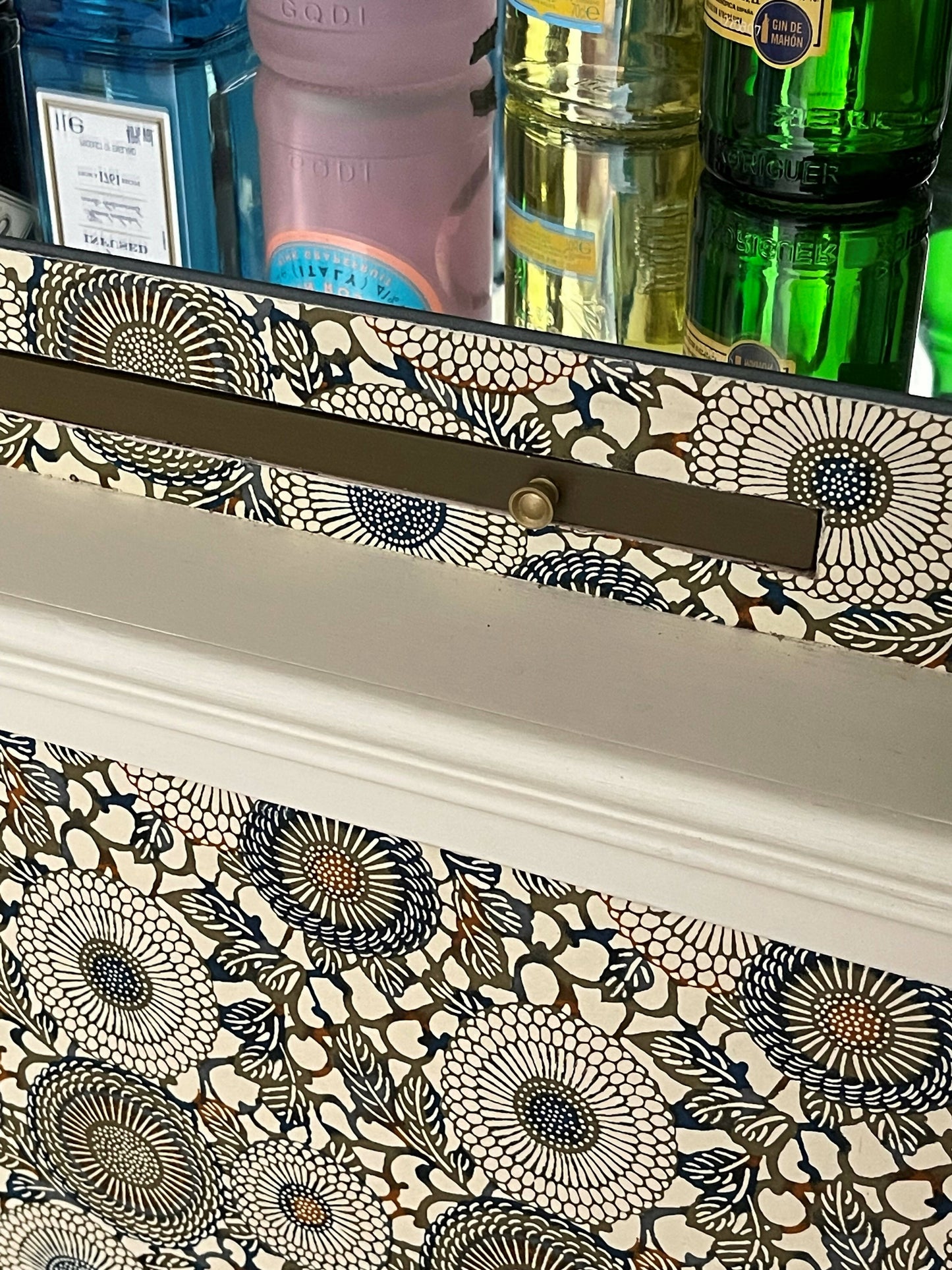 Unique drinks cabinet painted in green and cream