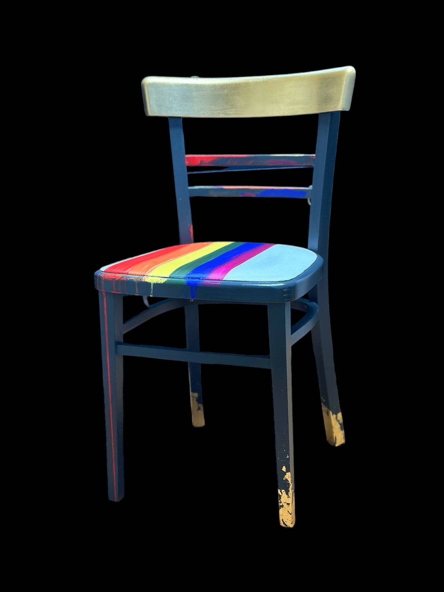 Hand painted school chair with vibrant rainbow stripe seat and gold leaf backrest. Abstract art design.