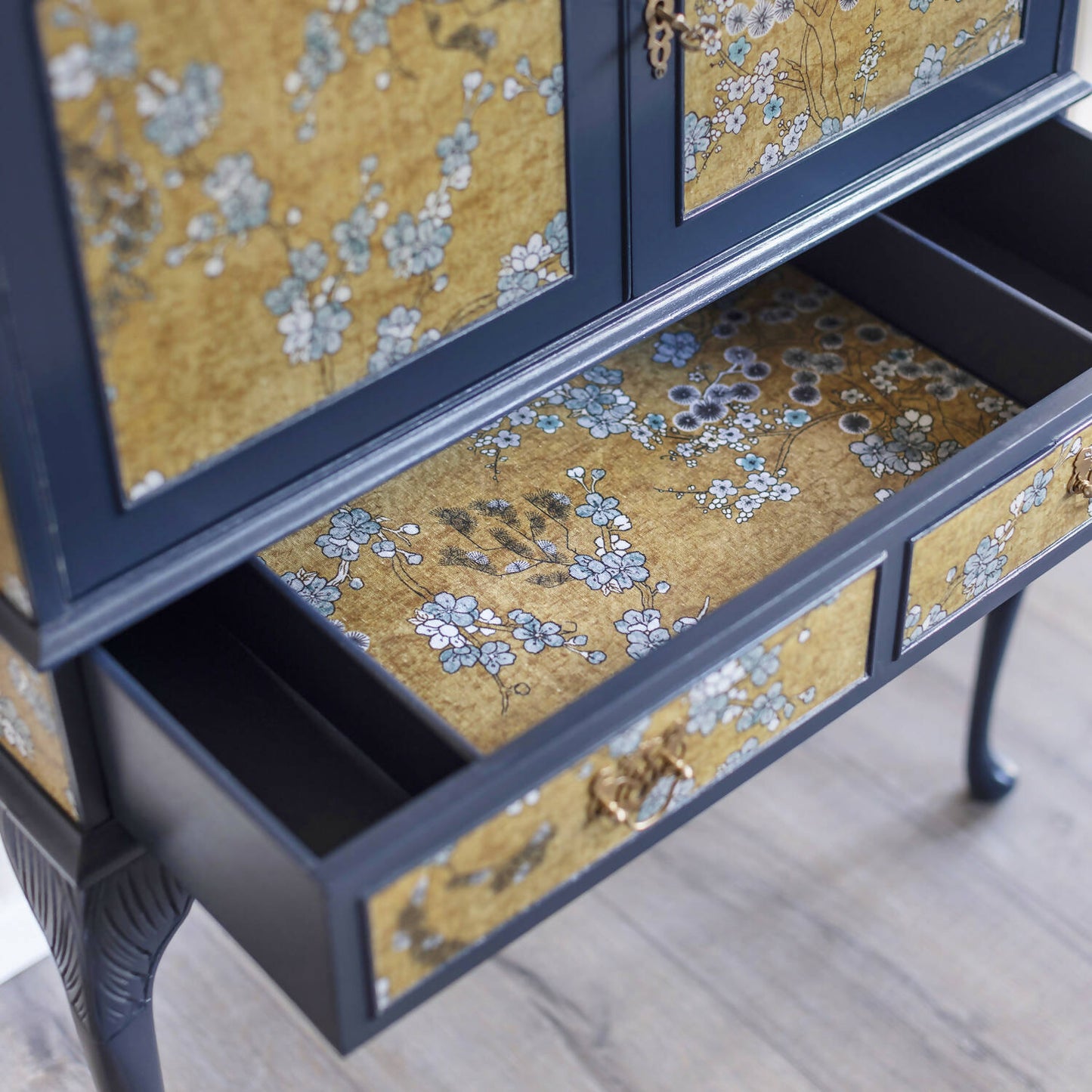 Exceptional vintage cocktail cabinet in midnight blue, boasting an oriental-inspired design. Sold, commission available.
