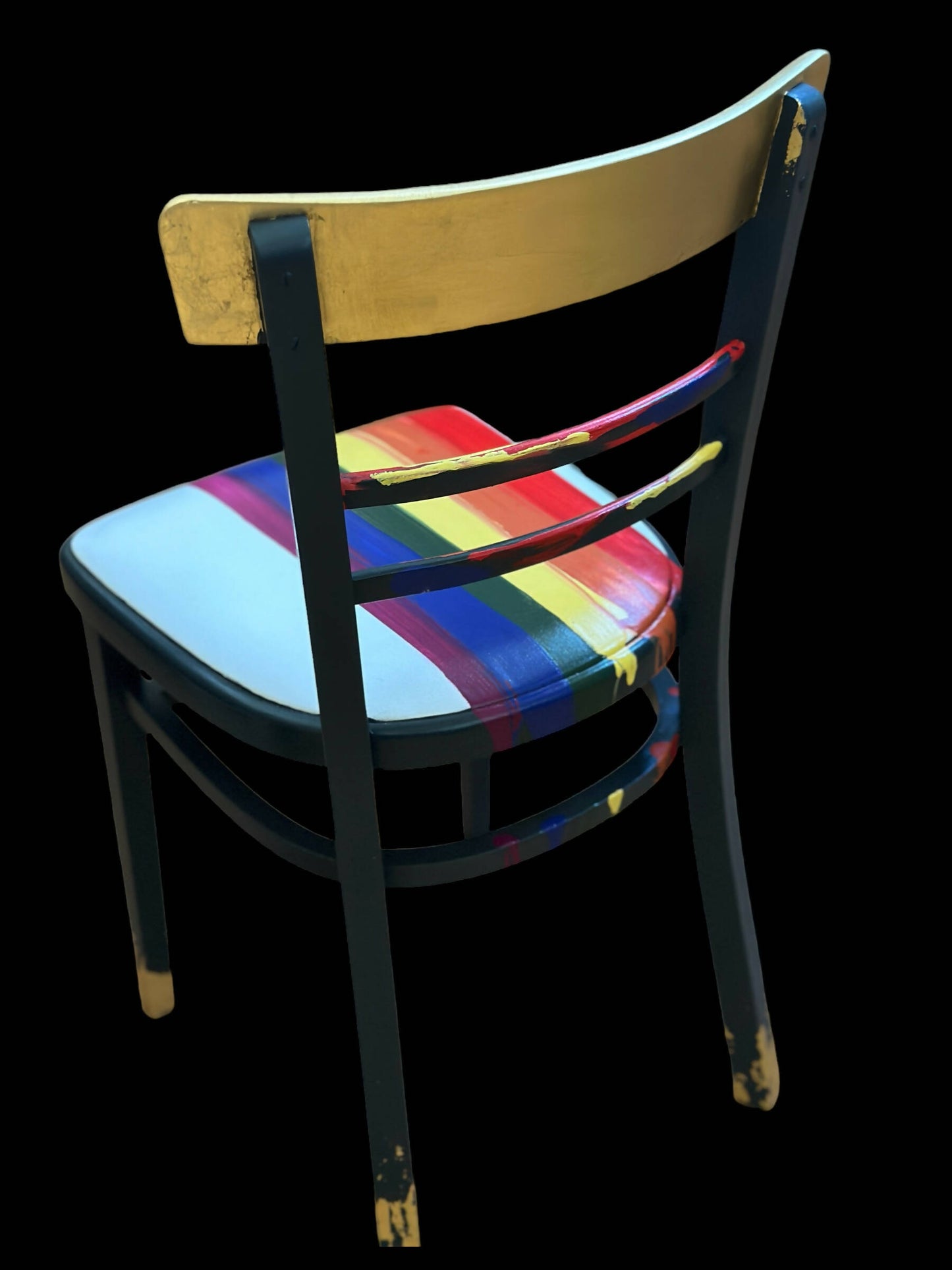 Hand painted school chair with vibrant rainbow stripe seat and gold leaf backrest. Abstract art design.