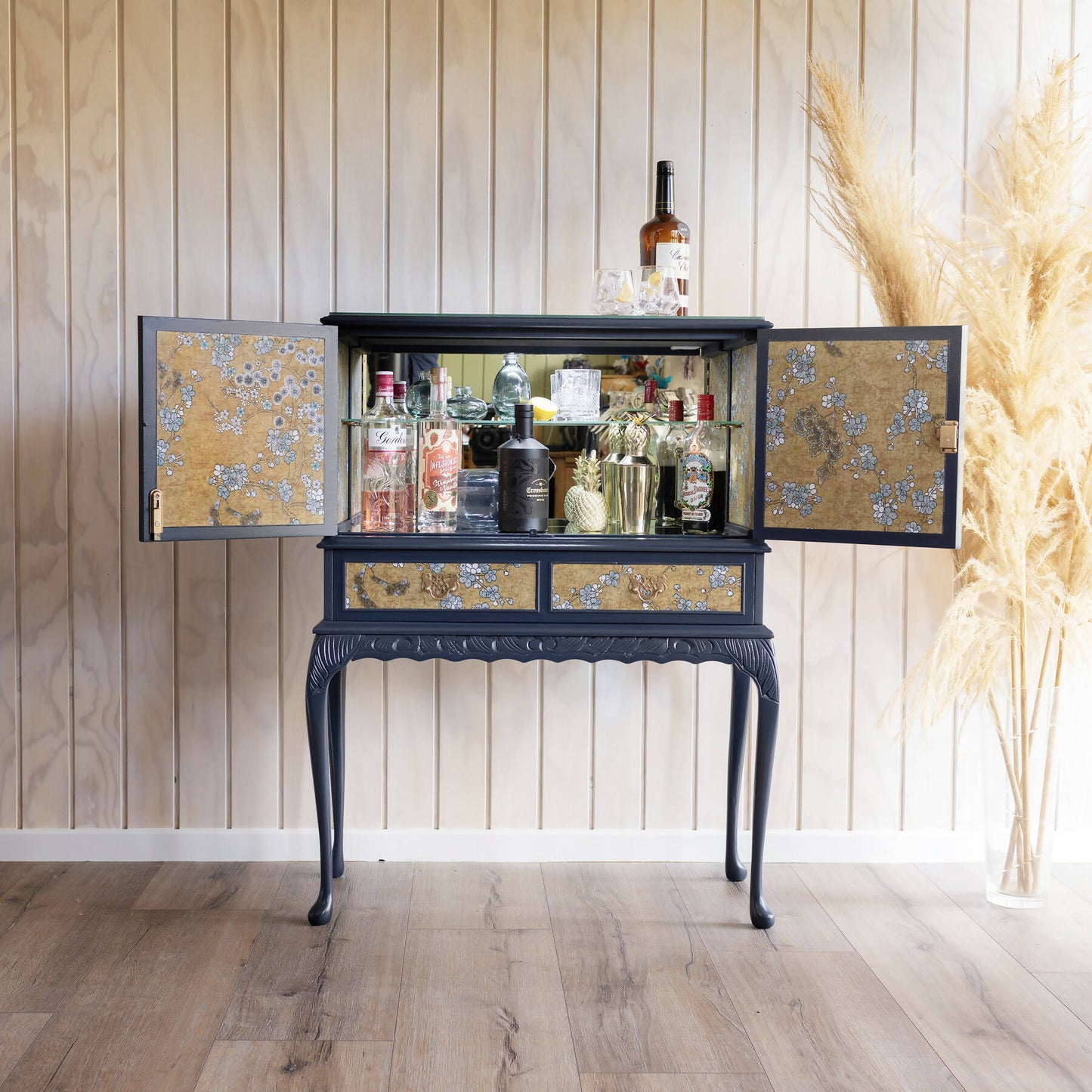 Exceptional vintage cocktail cabinet in midnight blue, boasting an oriental-inspired design. Sold, commission available.