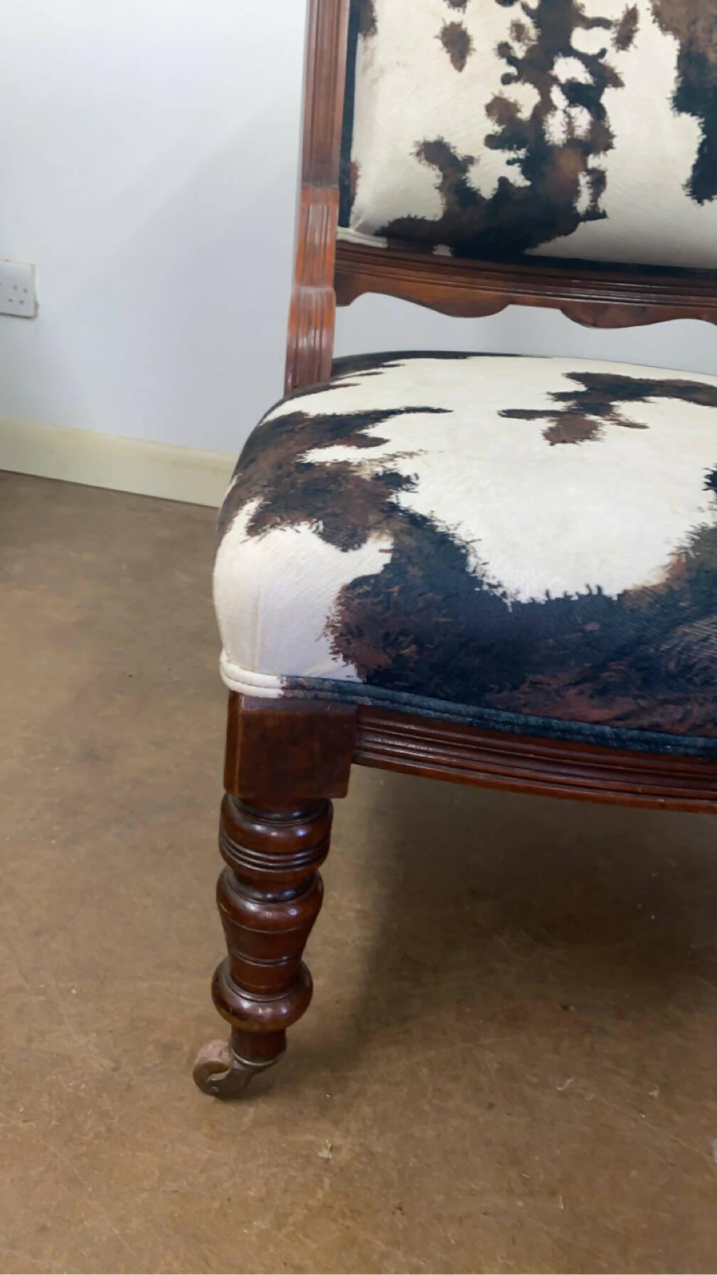 Reupholstered cowhide Victorian chair
