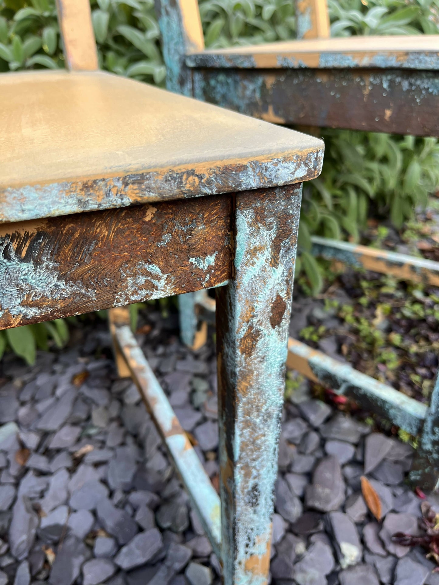 Two pumpkin and copper dining chairs