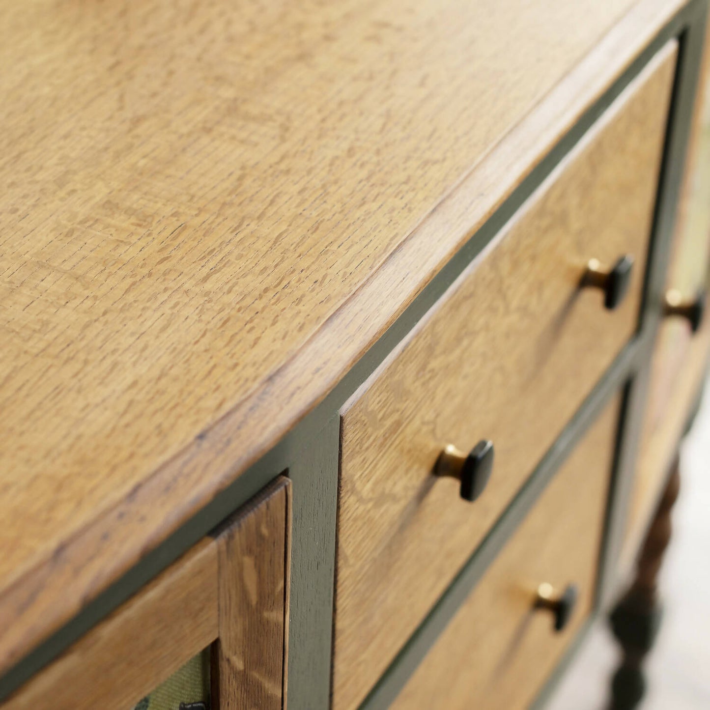 An exceptional vintage sideboard in a unique olive green hue, featuring an oval mirror and decoupaged in original Rockbird fabric. Sold: Commission Available.