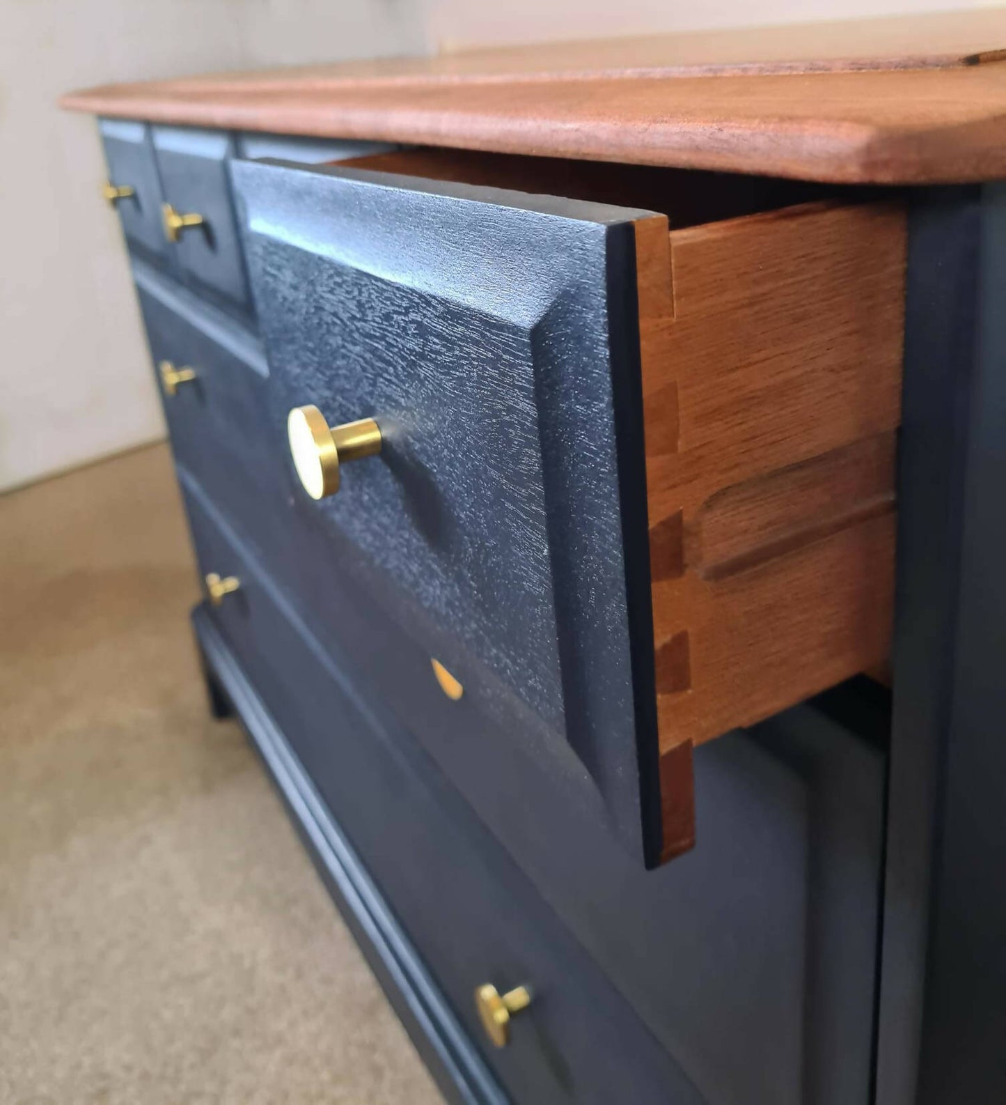 Stag 4/2 chest of drawers. 6 drawer painted navy blue with stripped wood top.