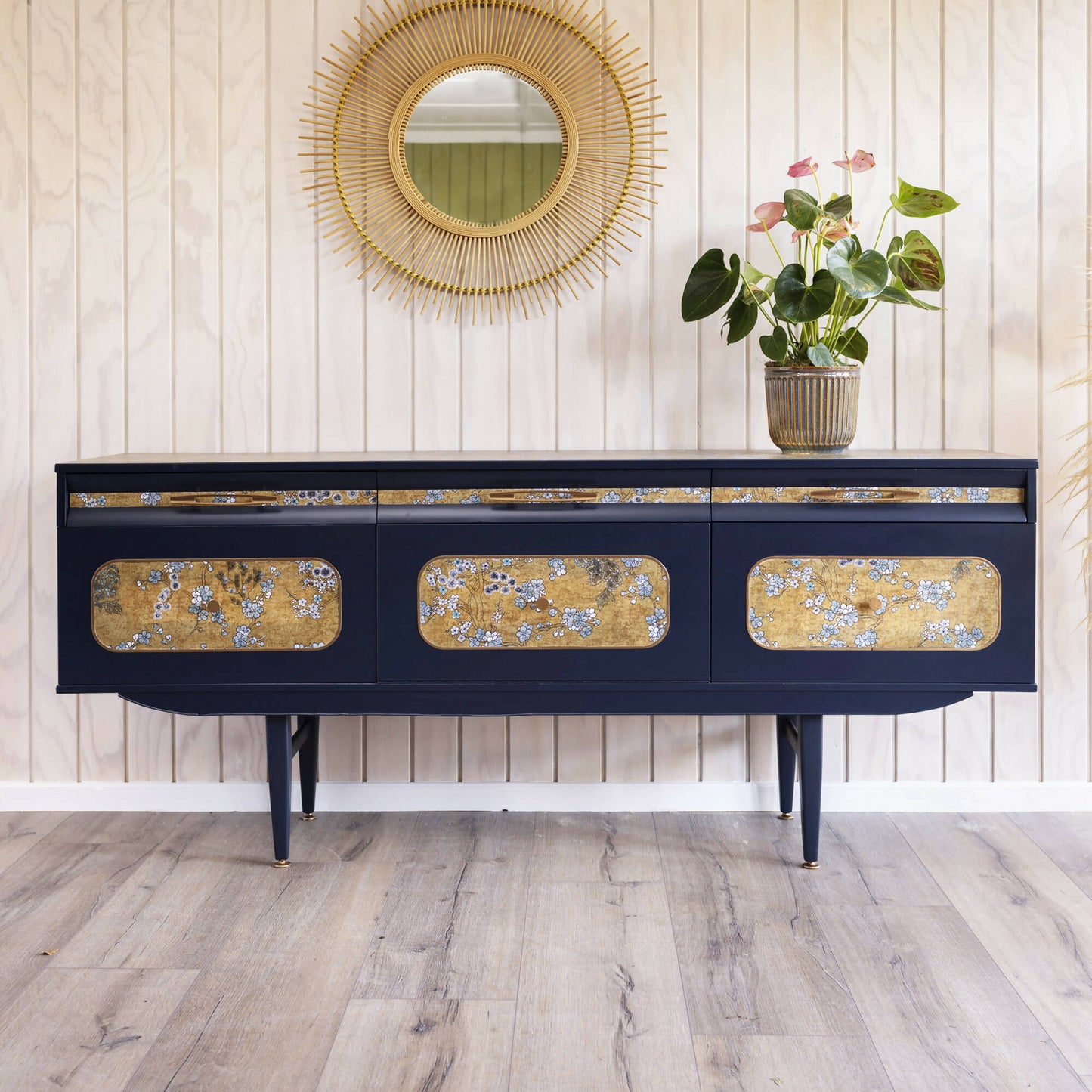 Blue mid century sideboard with an integrated cocktail bar, featuring a captivating blend of midnight blue and oriental fabric. Sold, commission available.