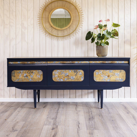 A unique Italian midcentury sideboard with an integrated cocktail bar, featuring a captivating blend of midnight blue and oriental fabric.