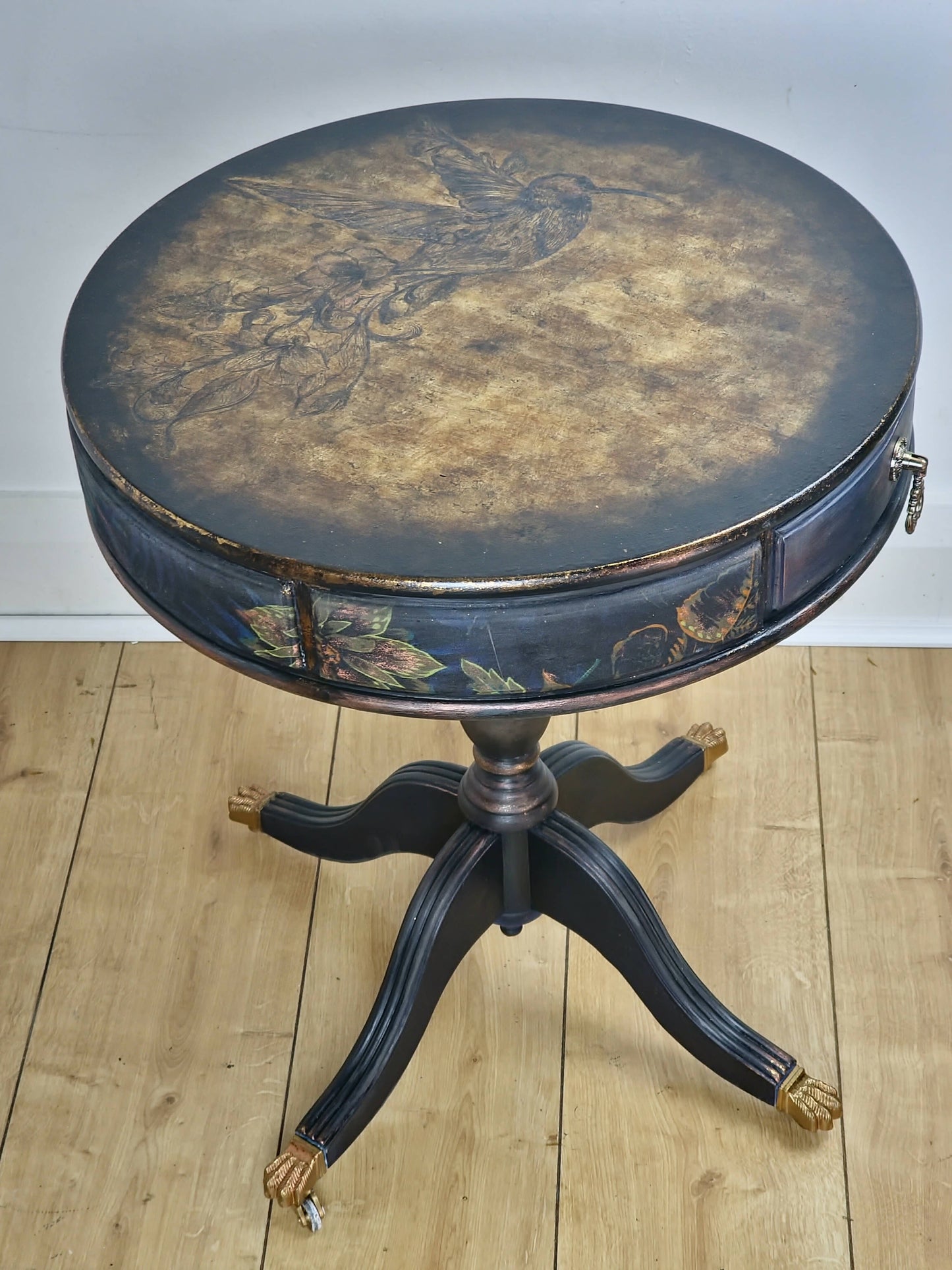 **Sold**Vintage Hand painted round side table, coffee table, Pedestal Drum Table, Round coffee table. Black table, Navy Gold Amber. Two drawers.