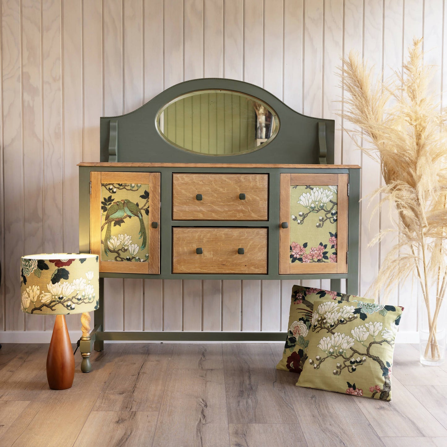 An exceptional vintage sideboard in a unique olive green hue, featuring an oval mirror and decoupaged in original Rockbird fabric. Sold: Commission Available.