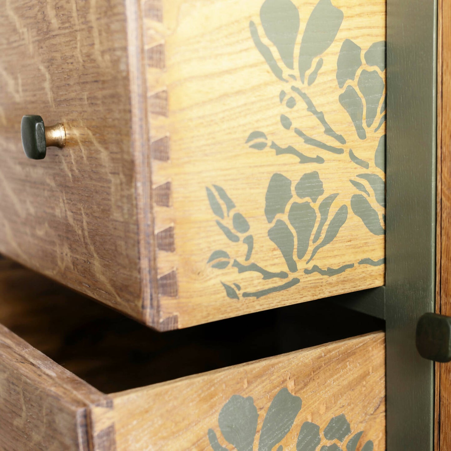 An exceptional vintage sideboard in a unique olive green hue, featuring an oval mirror and decoupaged in original Rockbird fabric. Sold: Commission Available.