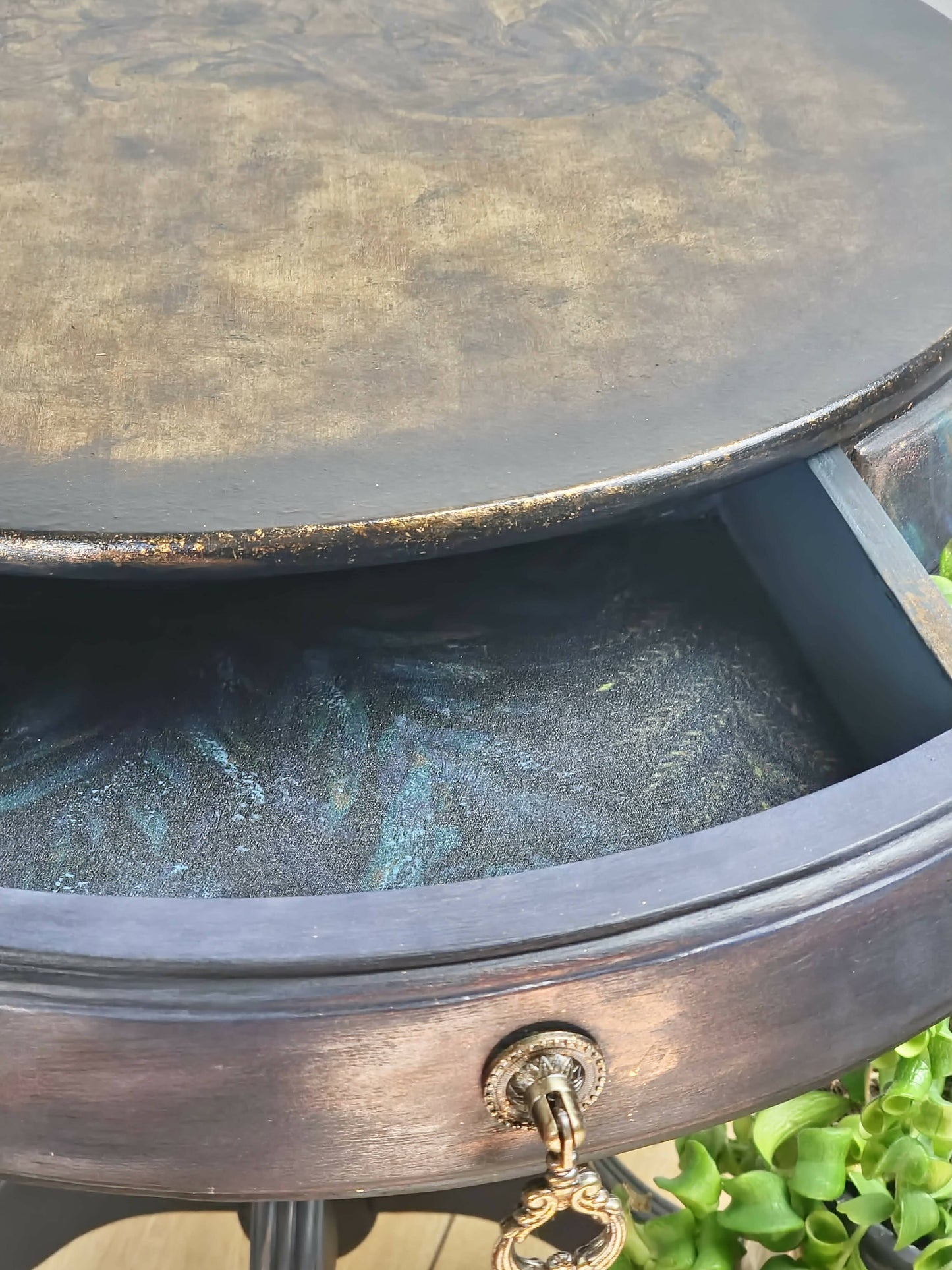 **Sold**Vintage Hand painted round side table, coffee table, Pedestal Drum Table, Round coffee table. Black table, Navy Gold Amber. Two drawers.