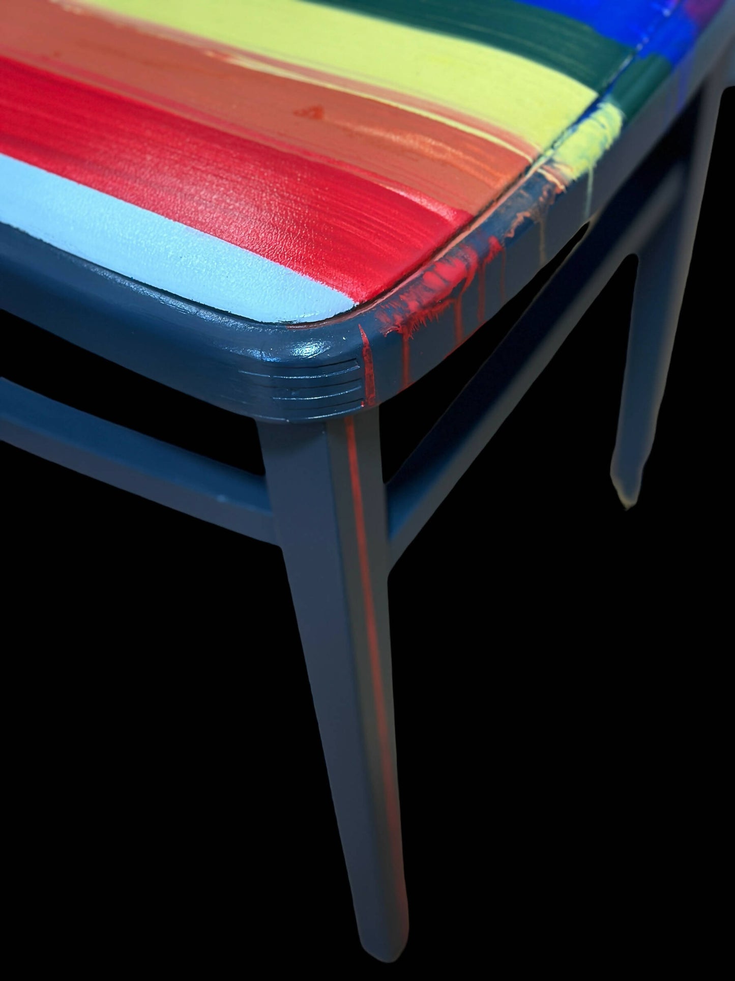 Hand painted school chair with vibrant rainbow stripe seat and gold leaf backrest. Abstract art design.