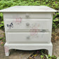 Stag Minstrel beside cabinet with 2 drawers & pullout tray painted in clotted cream