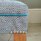 Long, Low Footstool, Restored and Reupholstered in Top Quality Woven Fabric.Teak wood feet. Newly Reupholstered.