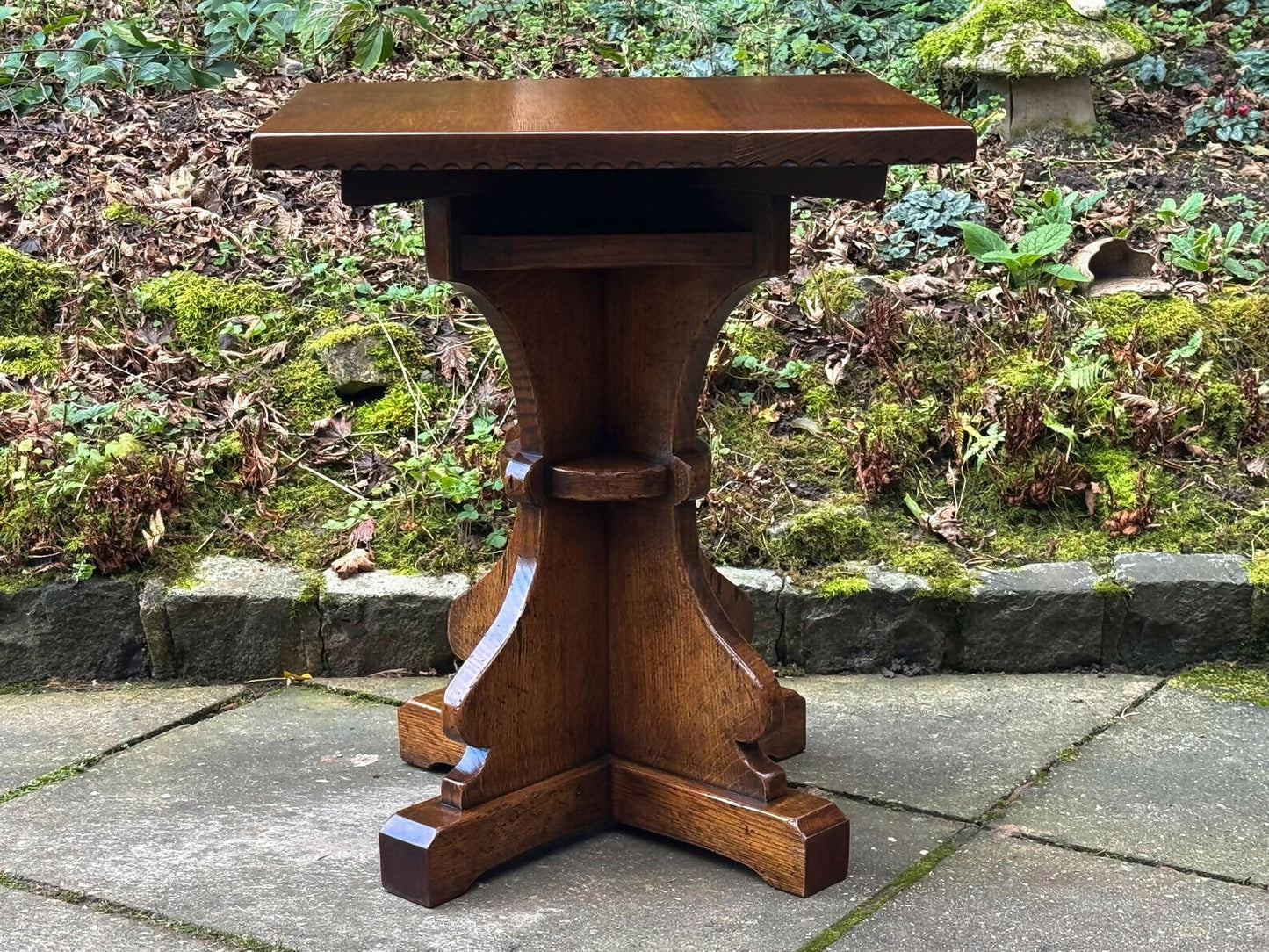 A RUPERT GRIFFITHS MONASTIC CARVED SOLID OAK LAMP TABLE / PLANT STAND