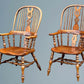 A Large Pair of Ash Broad Arm Windsor Chairs
