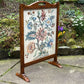 A RUPERT / NIGEL GRIFFITHS MONASTIC CARVED OAK FIRE SCREEN / STAND