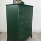 Stag minstrel tallboy chest of drawers in dark green