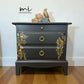 Matt Black Stag Minstrel bedside tables with gold floral and bird design. vintage nightstands. Teatray